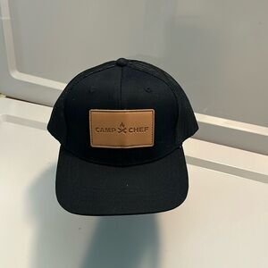 Camp Chef truckers black mesh hat with Brown patch Logo.  SnapBack OS fits most